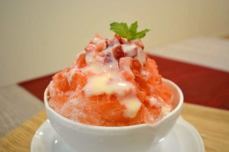 Shaved ice with strawberry syrup, strawberry, condensed milk